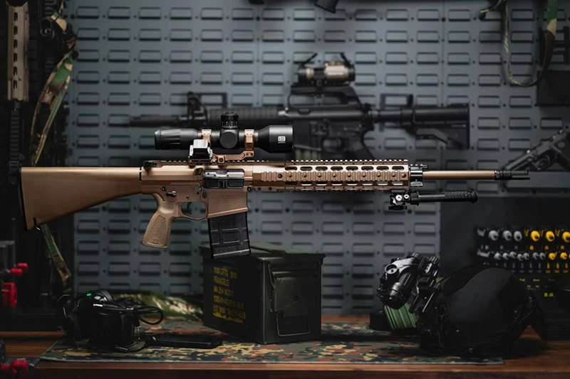 Scoped tan rifle on display